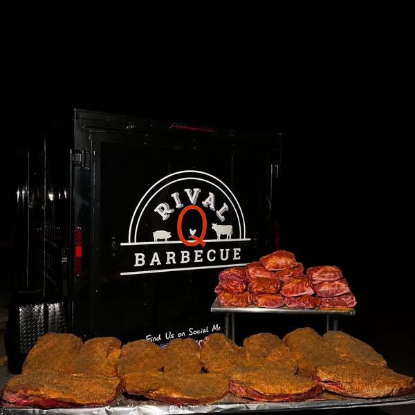 Rival Q trailer and briskets at night